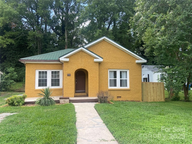 729 Elm St, Salisbury, NC 28144 - bungalow featuring stucco siding, a metal roof, and a standing seam roof
