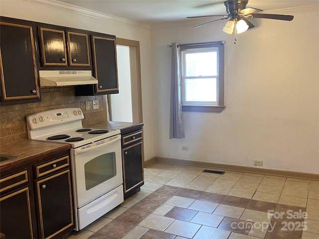 729 Elm St, Salisbury, NC 28144 - kitchen with electric stove, under cabinet range hood, decorative backsplash, tile countertops, and ornamental molding