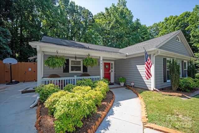 7627 Walnut Wood Dr, Charlotte, NC 28227 - ranch-style house featuring covered porch, a gate, and roof with shingles
