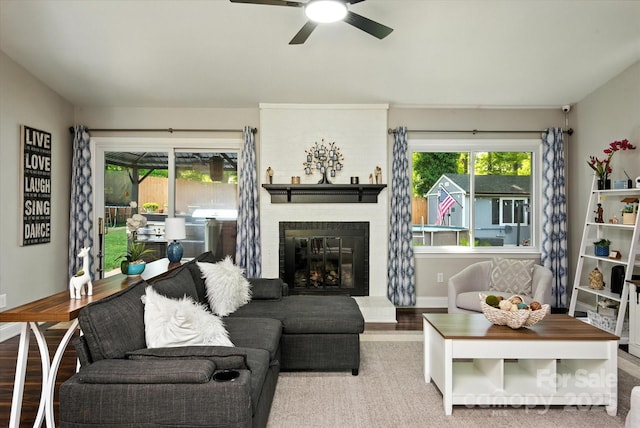 7627 Walnut Wood Dr, Charlotte, NC 28227 - living area featuring wood finished floors, a fireplace, and ceiling fan