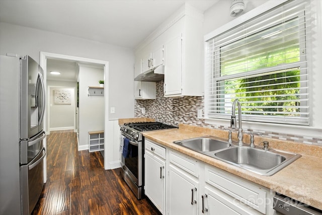 7627 Walnut Wood Dr, Charlotte, NC 28227 - kitchen featuring stainless steel appliances, under cabinet range hood, dark wood finished floors, light countertops, and tasteful backsplash