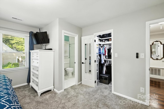 7627 Walnut Wood Dr, Charlotte, NC 28227 - bedroom with a walk in closet, carpet flooring, connected bathroom, and a closet