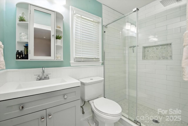 7627 Walnut Wood Dr, Charlotte, NC 28227 - full bath with a stall shower, vanity, and wainscoting