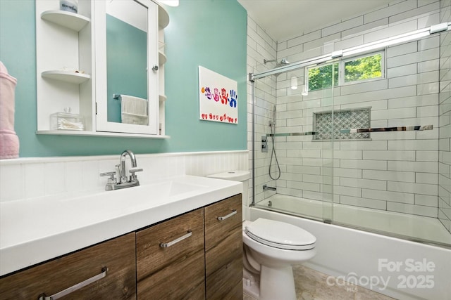 7627 Walnut Wood Dr, Charlotte, NC 28227 - bathroom with vanity, a wainscoted wall, and enclosed tub / shower combo