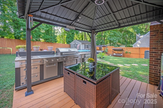 7627 Walnut Wood Dr, Charlotte, NC 28227 - wooden terrace with a fenced backyard, a storage shed, and a gazebo