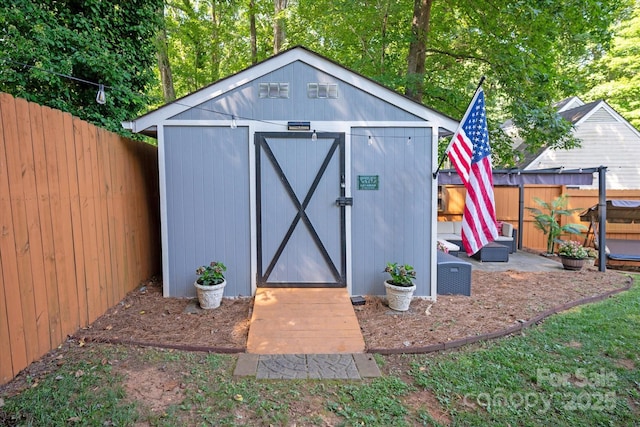 7627 Walnut Wood Dr, Charlotte, NC 28227 - view of shed with a fenced backyard