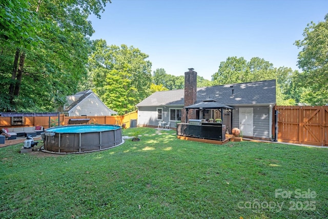 7627 Walnut Wood Dr, Charlotte, NC 28227 - fenced backyard featuring a hot tub and a gazebo
