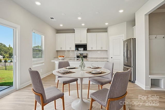 1997 Paddlewheel Dr, Stanley, NC 28164 - dining area with light wood-style flooring and recessed lighting