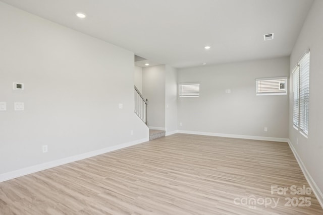 1997 Paddlewheel Dr, Stanley, NC 28164 - spare room featuring stairway, light wood-type flooring, and recessed lighting