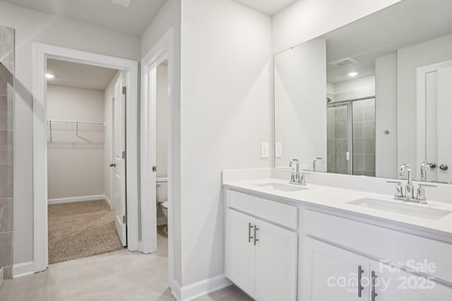 1997 Paddlewheel Dr, Stanley, NC 28164 - full bathroom with a stall shower, double vanity, a spacious closet, and recessed lighting