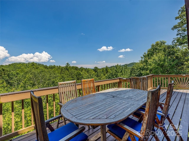220 Circle Pines Dr, Rosman, NC 28772 - wooden terrace featuring outdoor dining space and a wooded view