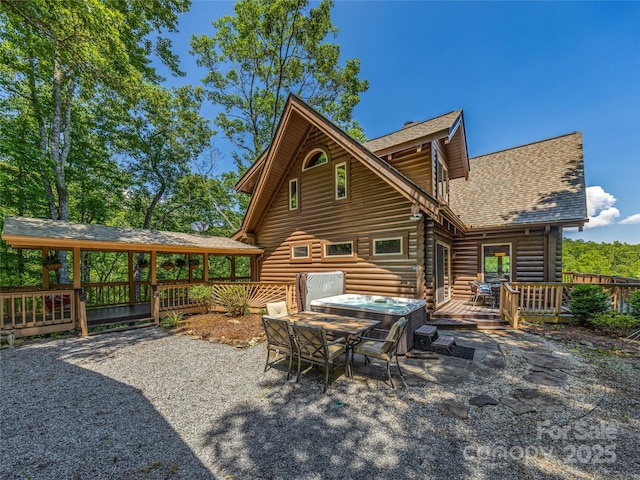 220 Circle Pines Dr, Rosman, NC 28772 - rear view of property with roof with shingles, a wooden deck, log exterior, a hot tub, and a patio