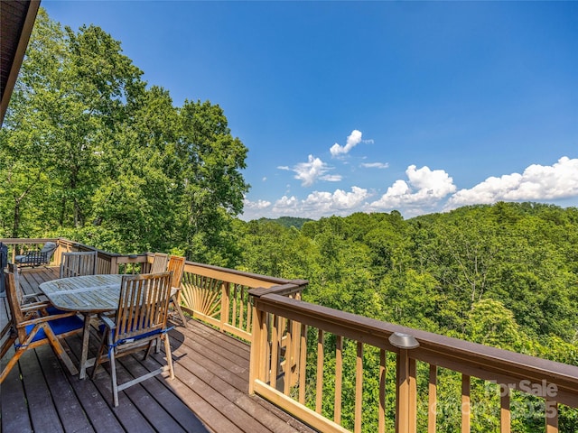 220 Circle Pines Dr, Rosman, NC 28772 - wooden deck with a wooded view and outdoor dining space