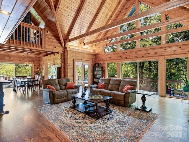 220 Circle Pines Dr, Rosman, NC 28772 - living area with high vaulted ceiling, wooden walls, a wooden ceiling with exposed beams, and wood finished floors