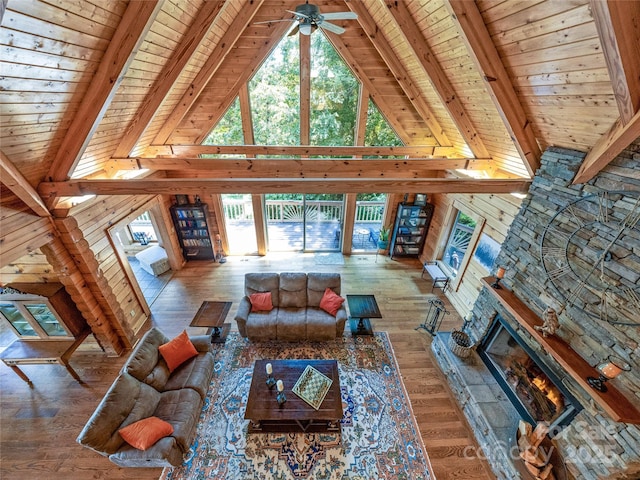 220 Circle Pines Dr, Rosman, NC 28772 - living area with a wood ceiling with exposed beams, a ceiling fan, high vaulted ceiling, wood finished floors, and a fireplace