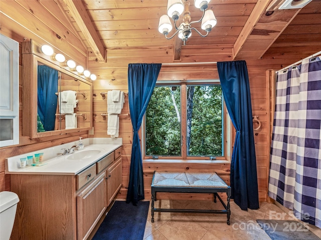 220 Circle Pines Dr, Rosman, NC 28772 - full bath featuring a wood ceiling with exposed beams, vanity, wood walls, a chandelier, and curtained shower