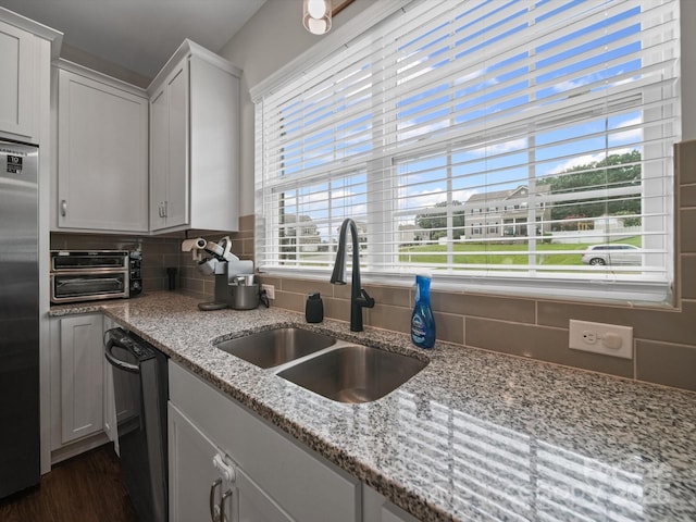 8810 Crape Myrtle Dr, Stanfield, NC 28163 - kitchen featuring stainless steel fridge, dishwasher, backsplash, and plenty of natural light