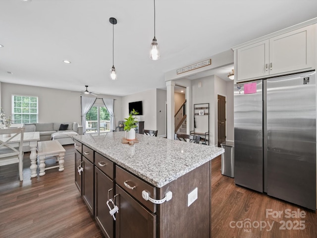 8810 Crape Myrtle Dr, Stanfield, NC 28163 - kitchen featuring freestanding refrigerator, open floor plan, dark wood-type flooring, healthy amount of natural light, and recessed lighting