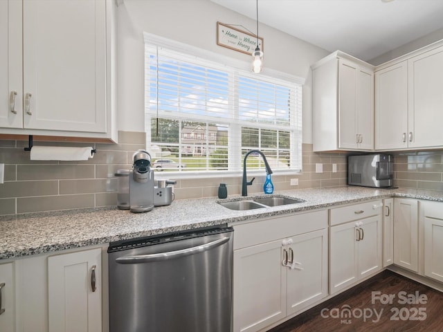 8810 Crape Myrtle Dr, Stanfield, NC 28163 - kitchen featuring stainless steel appliances, tasteful backsplash, white cabinetry, dark wood-style floors, and pendant lighting