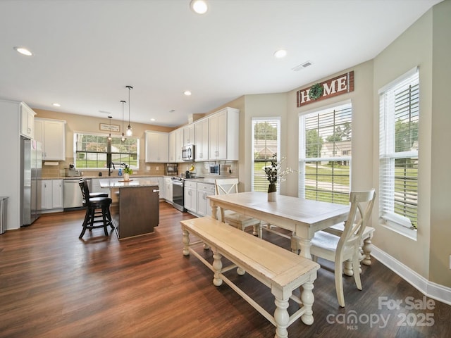 8810 Crape Myrtle Dr, Stanfield, NC 28163 - dining space with dark wood finished floors and recessed lighting