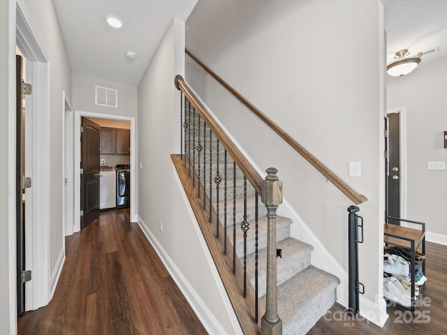 8810 Crape Myrtle Dr, Stanfield, NC 28163 - stairs featuring washing machine and clothes dryer and wood finished floors