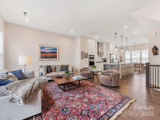 5018 Harrowsmith Ln, Charlotte, NC 28204 - living room with wood finished floors and recessed lighting