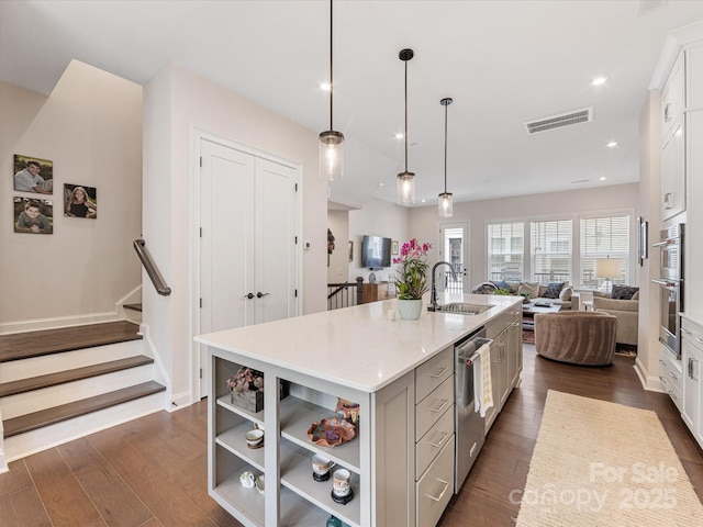 5018 Harrowsmith Ln, Charlotte, NC 28204 - kitchen featuring stainless steel appliances, open floor plan, dark wood-style floors, an island with sink, and recessed lighting