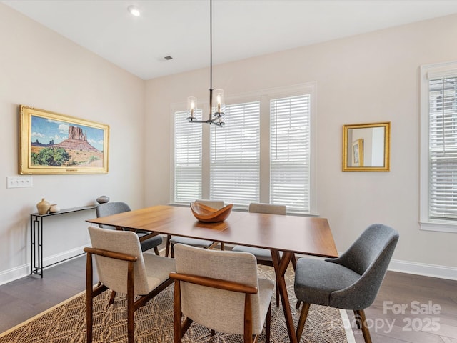 5018 Harrowsmith Ln, Charlotte, NC 28204 - dining room featuring dark wood-style floors and a chandelier