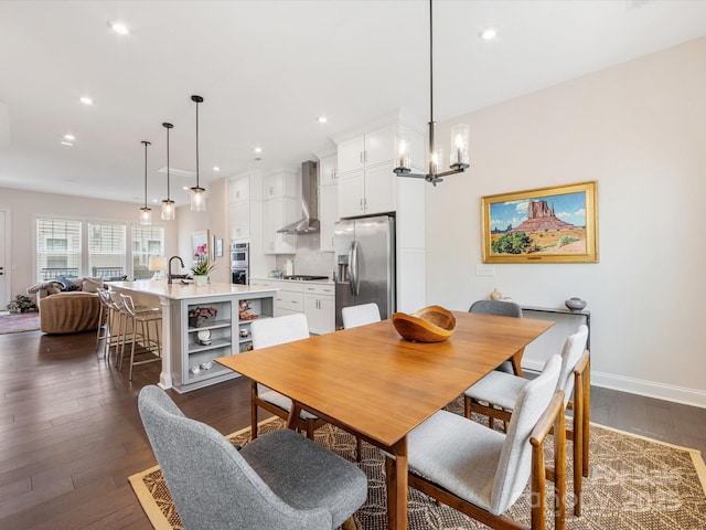 5018 Harrowsmith Ln, Charlotte, NC 28204 - dining area featuring dark wood-style flooring, recessed lighting, and a chandelier
