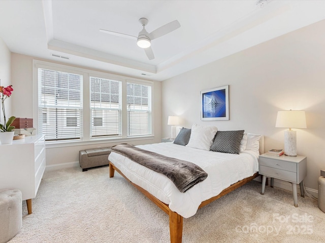 5018 Harrowsmith Ln, Charlotte, NC 28204 - bedroom featuring a raised ceiling, light carpet, and a ceiling fan