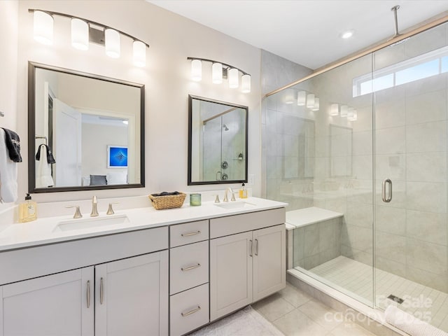 5018 Harrowsmith Ln, Charlotte, NC 28204 - full bath featuring a shower stall, double vanity, and tile patterned flooring