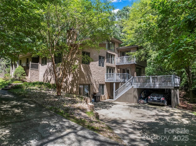 6724 Riverfront Dr, Charlotte, NC 28216 - view of building exterior with driveway and stairway