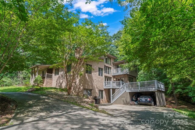 6724 Riverfront Dr, Charlotte, NC 28216 - view of building exterior featuring driveway and a carport