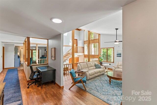 6724 Riverfront Dr, Charlotte, NC 28216 - living area featuring stairway, hardwood / wood-style flooring, and ceiling fan