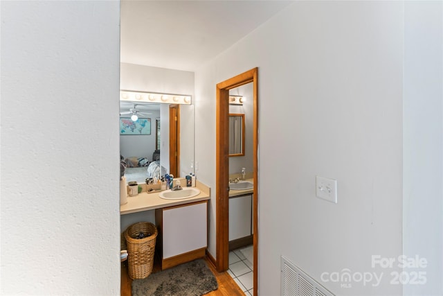 6724 Riverfront Dr, Charlotte, NC 28216 - ensuite bathroom featuring vanity and wood finished floors