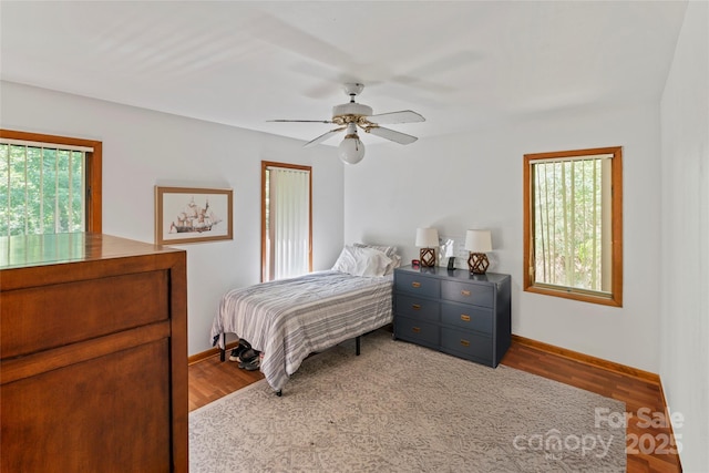 6724 Riverfront Dr, Charlotte, NC 28216 - bedroom featuring wood finished floors and ceiling fan