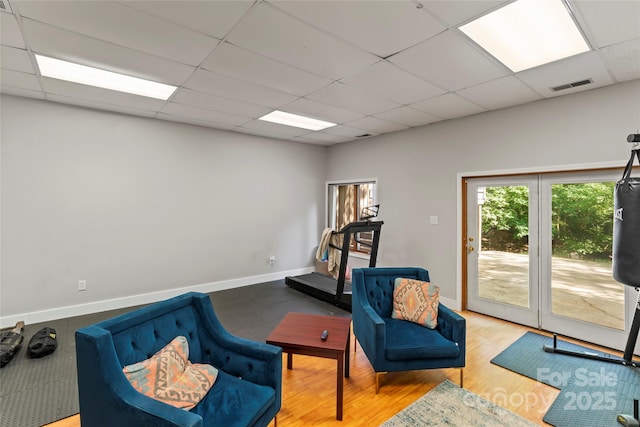6724 Riverfront Dr, Charlotte, NC 28216 - living area with a drop ceiling and wood finished floors