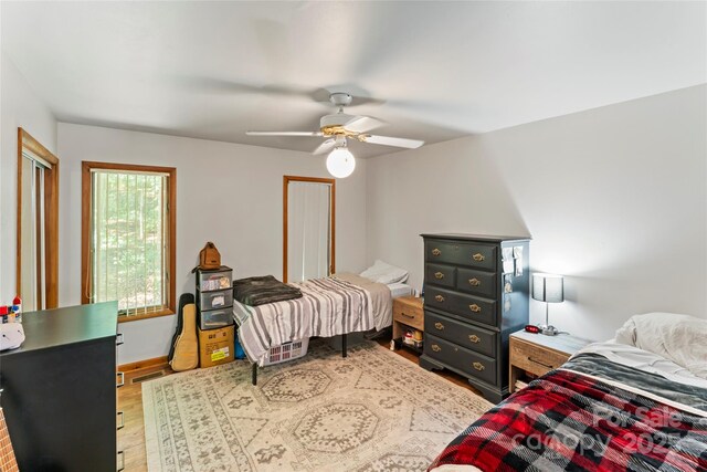 6724 Riverfront Dr, Charlotte, NC 28216 - bedroom featuring wood finished floors and ceiling fan