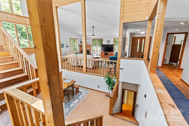6724 Riverfront Dr, Charlotte, NC 28216 - stairs with plenty of natural light, ceiling fan, vaulted ceiling, and recessed lighting