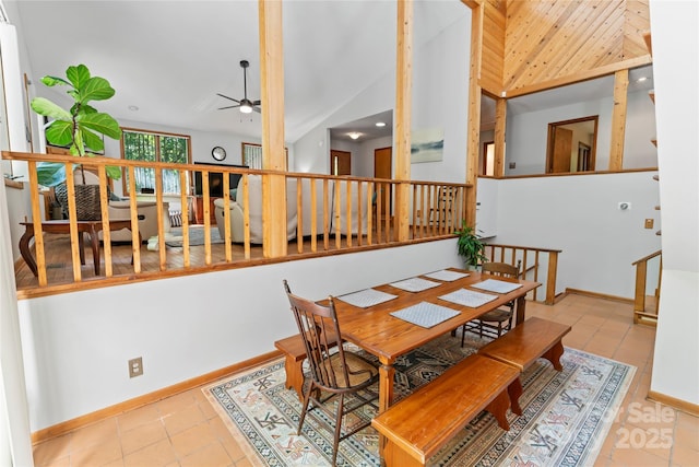 6724 Riverfront Dr, Charlotte, NC 28216 - dining area with ceiling fan, tile patterned floors, vaulted ceiling, and stairway