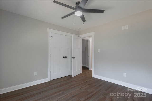5005 Oconee Dr, Stanley, NC 28164 - unfurnished bedroom with wood finished floors, a closet, and a ceiling fan