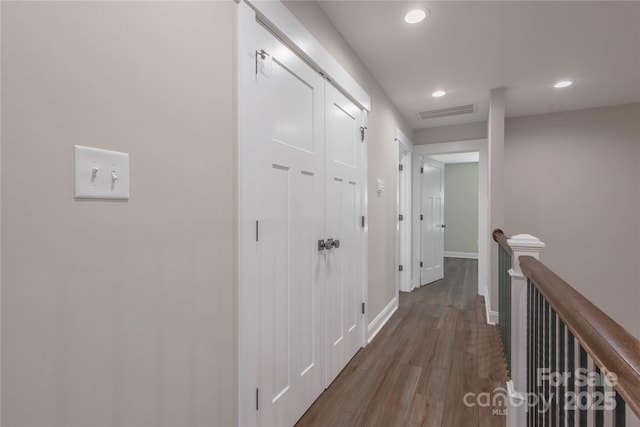 5005 Oconee Dr, Stanley, NC 28164 - hall featuring an upstairs landing, wood finished floors, and recessed lighting