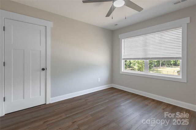 5005 Oconee Dr, Stanley, NC 28164 - unfurnished room with wood finished floors and a ceiling fan