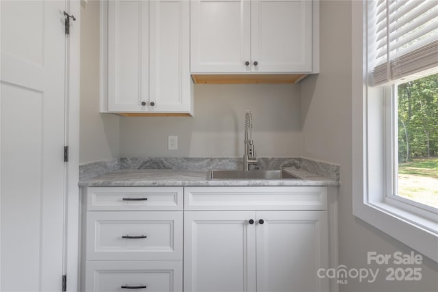 5005 Oconee Dr, Stanley, NC 28164 - kitchen with a sink and white cabinetry