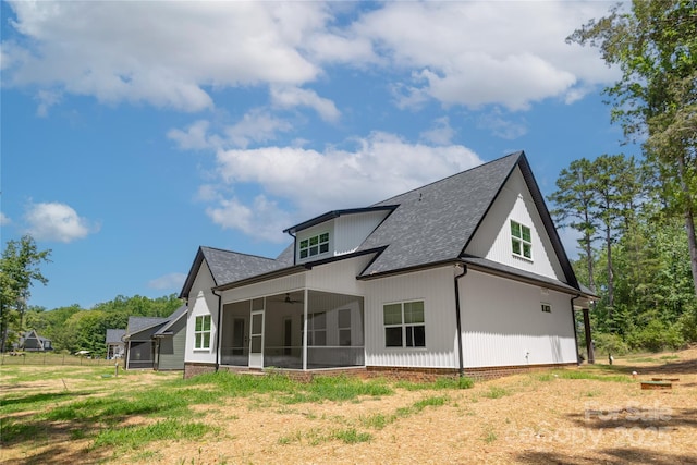 5005 Oconee Dr, Stanley, NC 28164 - back of house with a sunroom, a ceiling fan, and a shingled roof