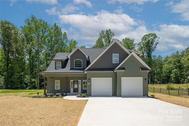 5009 Oconee Dr, Stanley, NC 28164 - craftsman-style house with concrete driveway, a porch, an attached garage, and a shingled roof