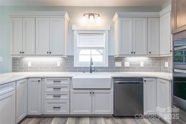 5009 Oconee Dr, Stanley, NC 28164 - kitchen with appliances with stainless steel finishes, backsplash, and light stone counters