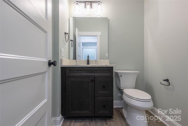 5009 Oconee Dr, Stanley, NC 28164 - bathroom featuring vanity and wood finished floors