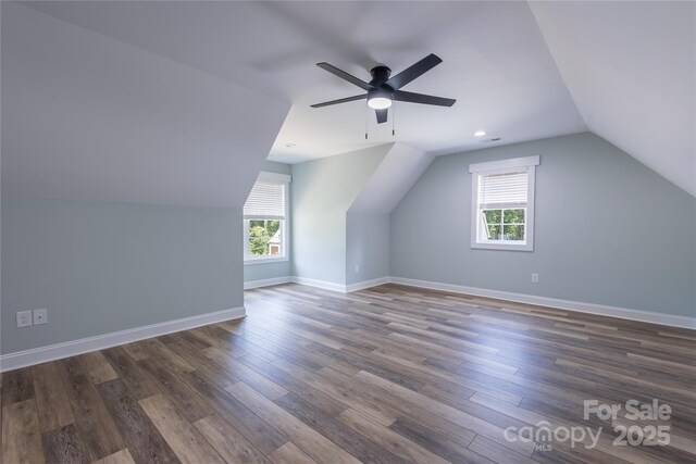 5009 Oconee Dr, Stanley, NC 28164 - bonus room with plenty of natural light, vaulted ceiling, dark wood finished floors, and a ceiling fan
