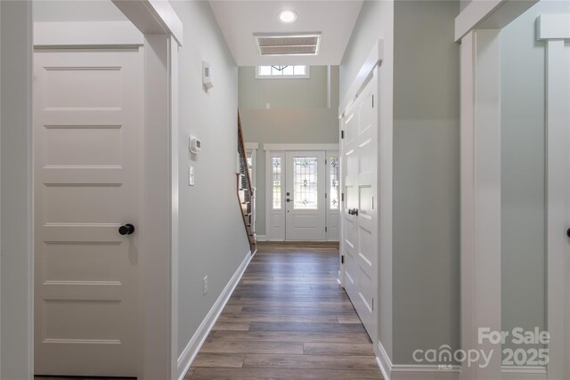 5009 Oconee Dr, Stanley, NC 28164 - doorway to outside with dark wood finished floors and healthy amount of natural light
